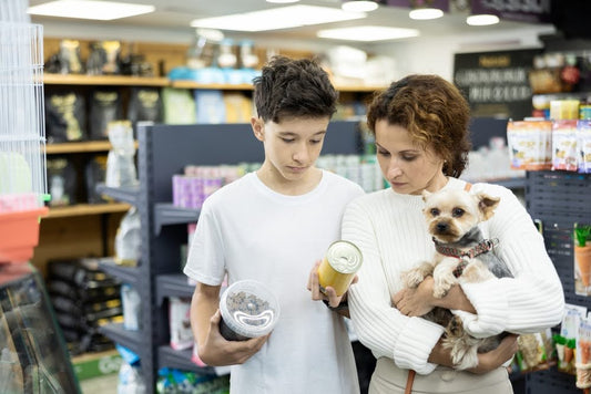 mother and son looking at a dog food can to read the label